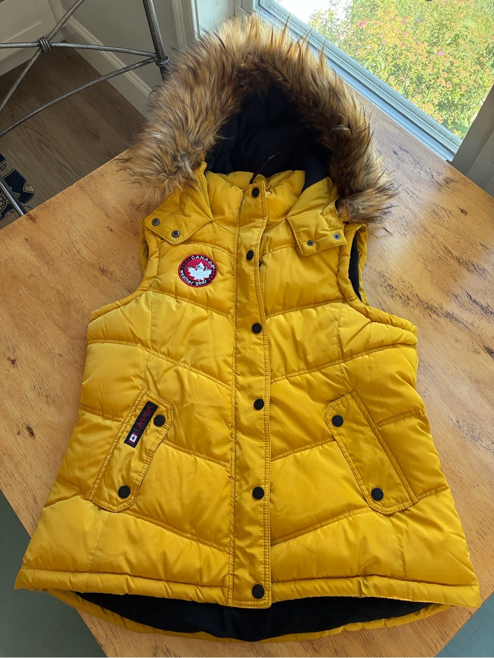 Canada Goose Woman’s Yellow Hooded Puffer Vest with Faux Fur Trim- New w/o tag.